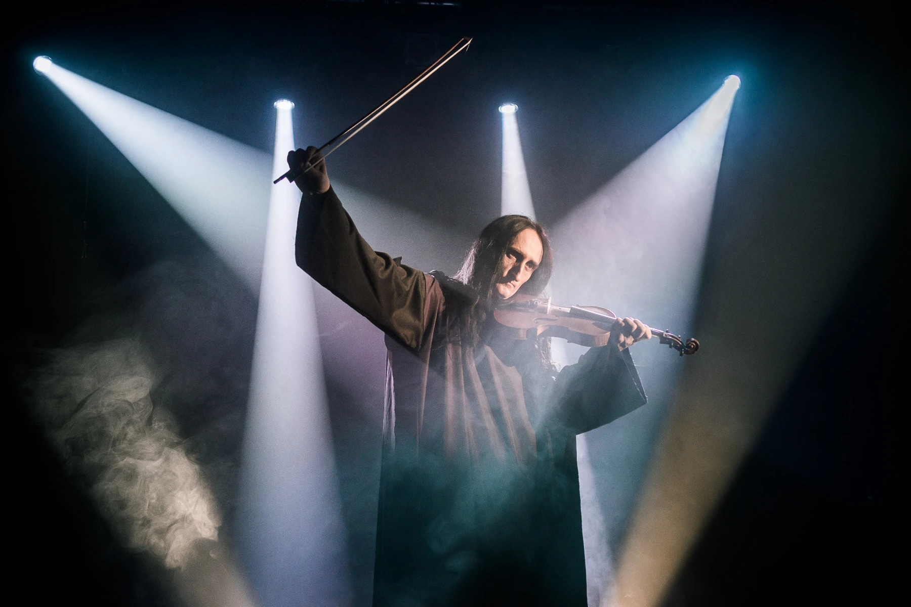 Paganini with violin and raised bow