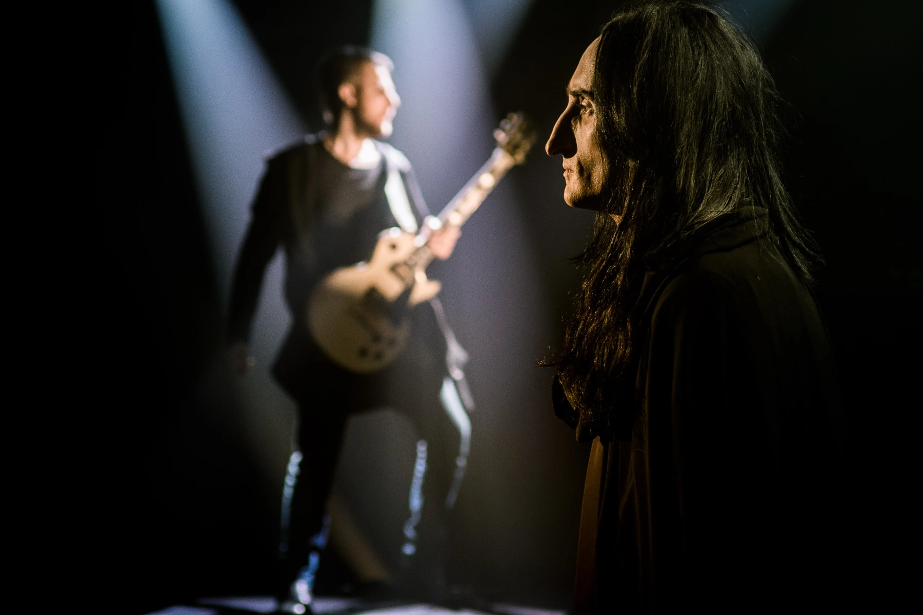 Paganini in the foreground, Alex playing guitar behind him