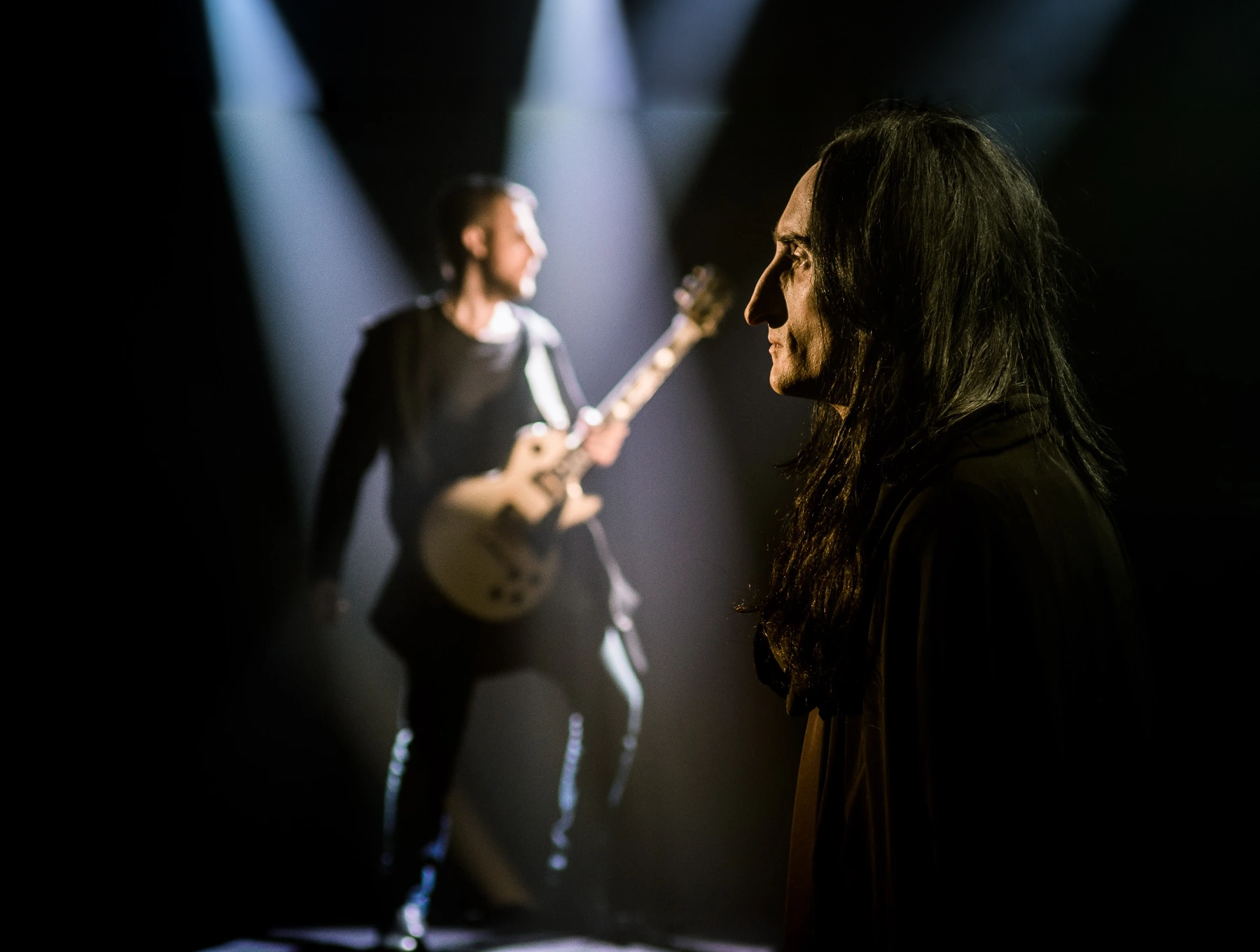 Paganini in the foreground, Alex with his guitar behind him
